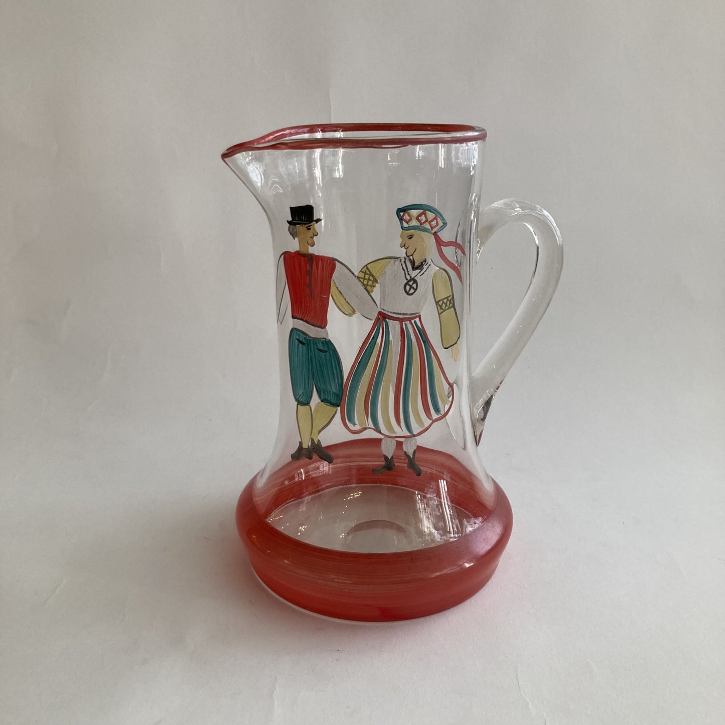 Äldre målad kanna i glas