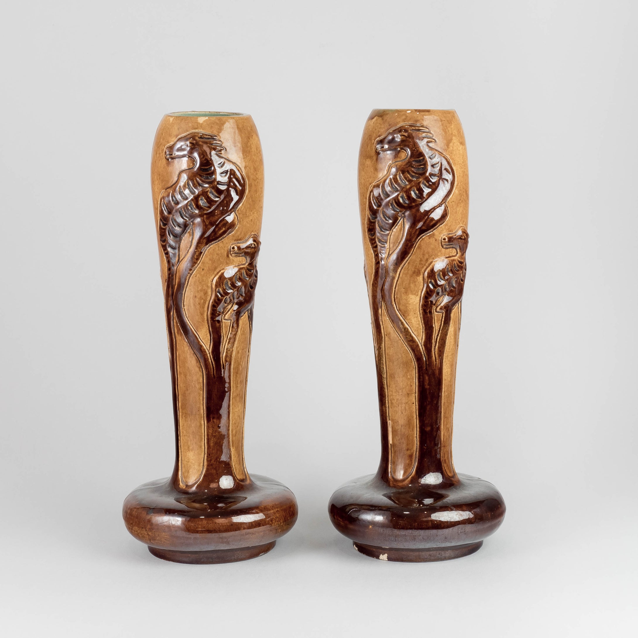 Vaser jugend, av Karl Holst för Höganäs. 29 cm höga, nagg. Signerade Höganäs KH. 1975 kr/st. Art Nouveau vases by Karl Holst for Höganäs. H: 29cm/11,4